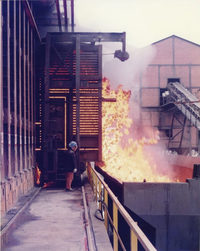 Hot coke being pushed out of a retort at Ravenscraig.