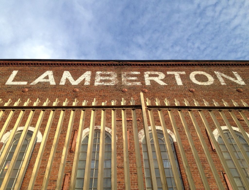 The listed Sunnyside Engine Works building towers over Coatbridge Sunnyside Station.