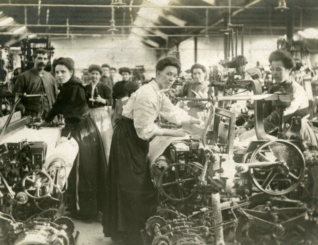 Workers at their power-looms in the Airdrie Cotton Works, around 1910.
