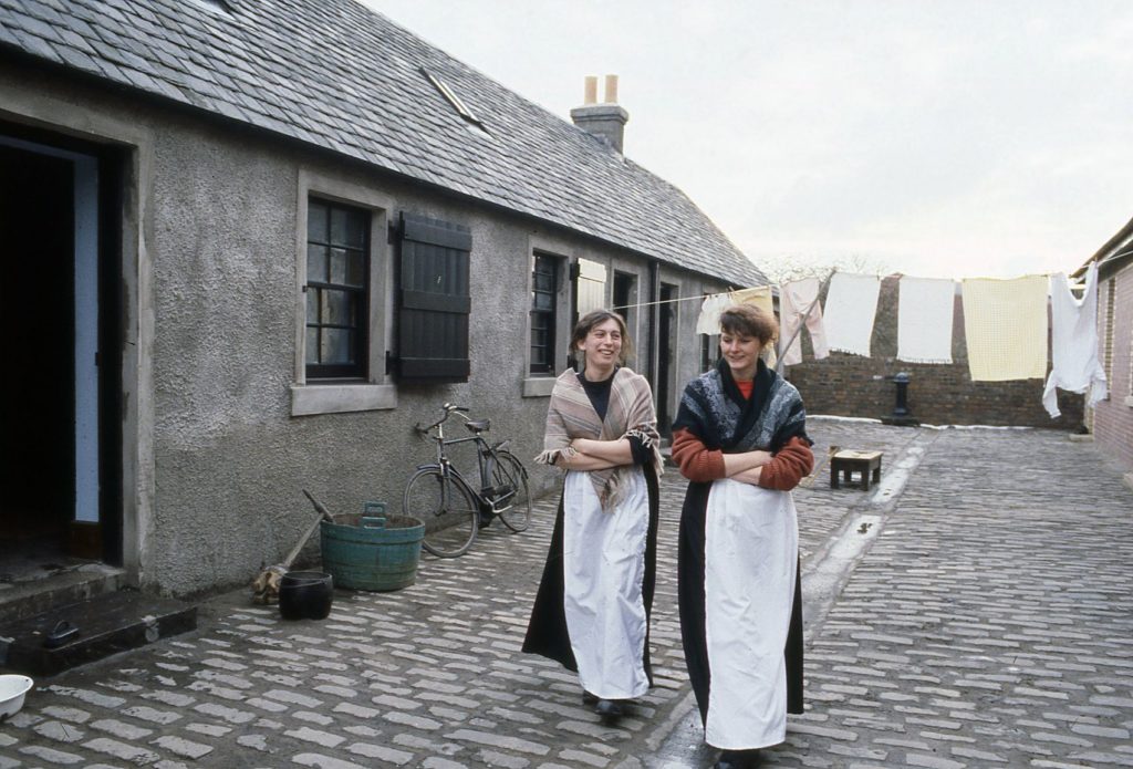 Staff members Lisa and Carol Ann outside the miners' rows, around 1990.